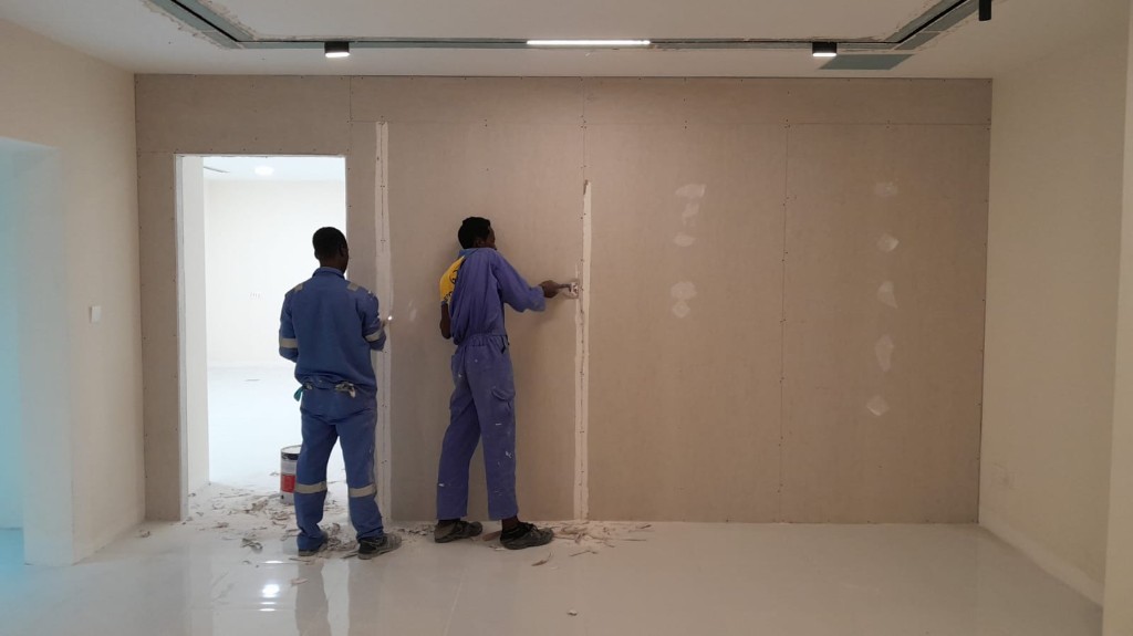 Gypsum partition wall installation and finishing in progress