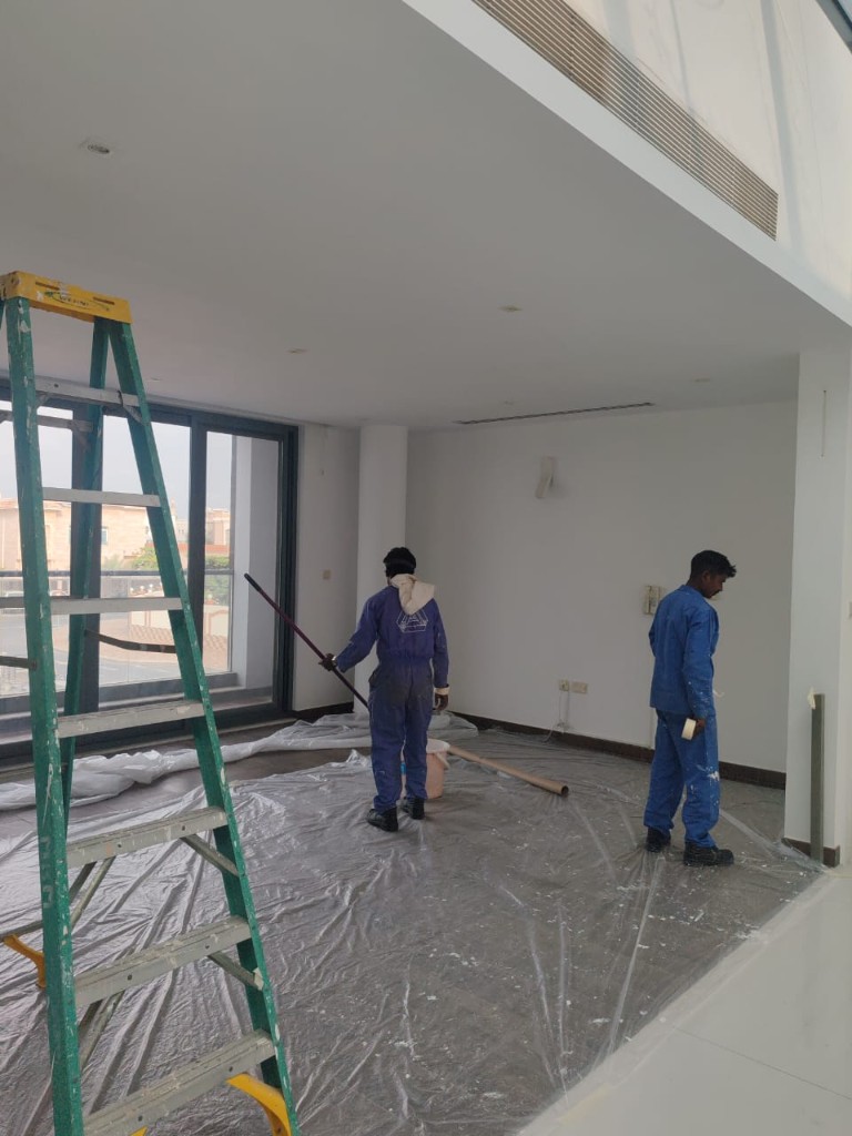 Fitout crew preparing a residential interior with floor protection